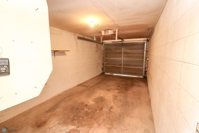 1219 7th St S Unit 1, Moorhead, MN 56560 - garage featuring concrete block wall