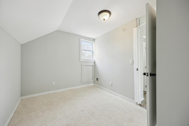 bonus room with lofted ceiling, visible vents, carpet flooring, and baseboards