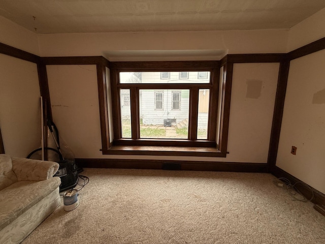 616 5th St, Madison, MN 56256 - carpeted empty room featuring baseboards