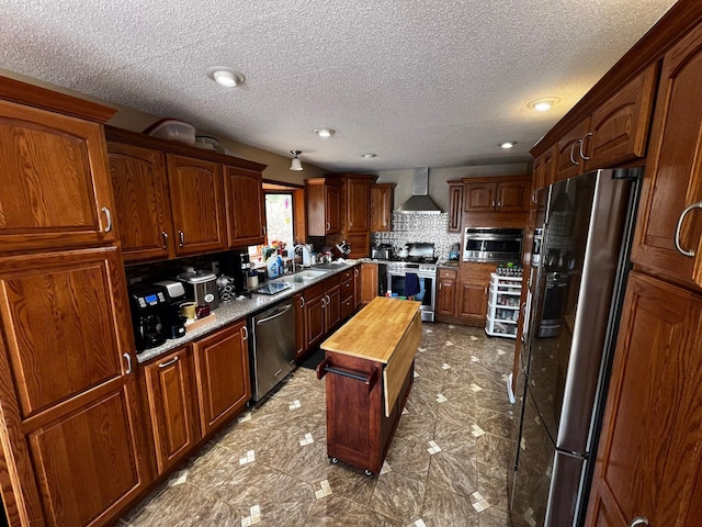 22612 Greenwood Loop, Park Rapids, MN 56470 - kitchen with appliances with stainless steel finishes, wall chimney exhaust hood, butcher block counters, backsplash, and a textured ceiling