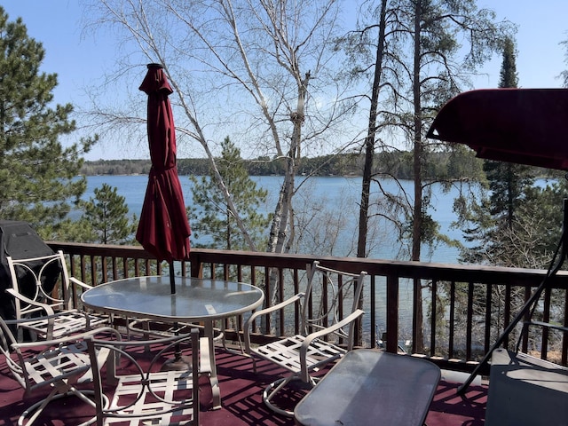 22612 Greenwood Loop, Park Rapids, MN 56470 - deck featuring a water view and outdoor dining space
