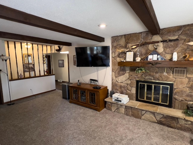 22612 Greenwood Loop, Park Rapids, MN 56470 - living area featuring carpet, beamed ceiling, a stone fireplace, and baseboards