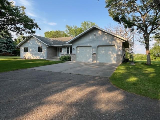 4762 383rd St, Sartell, MN 56377 - ranch-style home with an attached garage, asphalt driveway, and a front yard