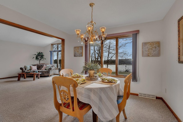 4762 383rd St, Sartell, MN 56377 - carpeted dining space with a chandelier, a water view, and baseboards