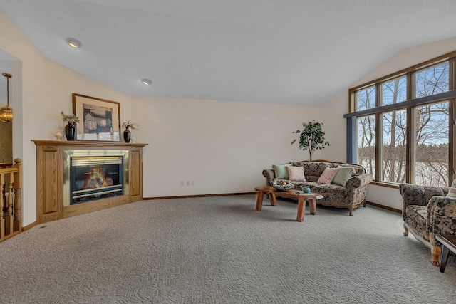 4762 383rd St, Sartell, MN 56377 - carpeted living area with vaulted ceiling, baseboards, and a glass covered fireplace