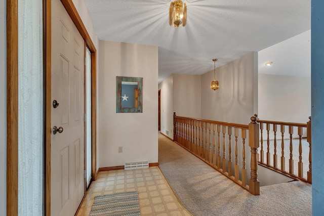 4762 383rd St, Sartell, MN 56377 - hallway featuring an upstairs landing, baseboards, a textured ceiling, and light floors