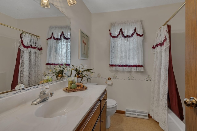 4762 383rd St, Sartell, MN 56377 - bathroom featuring vanity, toilet, and shower / bath combo with shower curtain