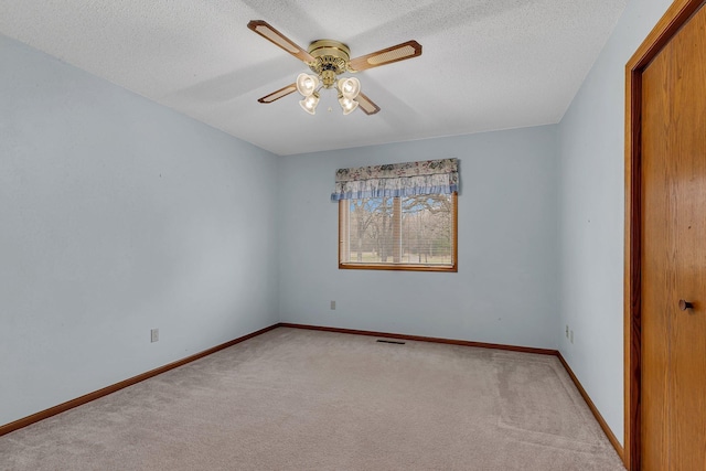 4762 383rd St, Sartell, MN 56377 - spare room featuring ceiling fan, light colored carpet, baseboards, and a textured ceiling
