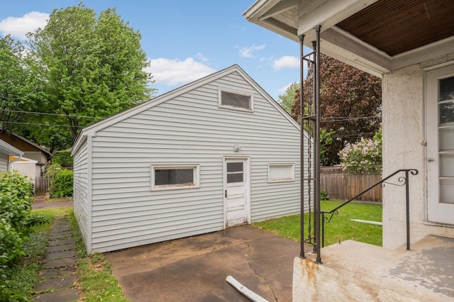 view of side of property with a patio