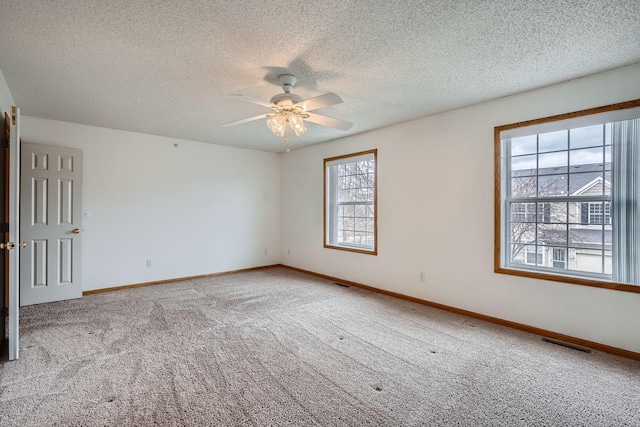 13626 Brass Pkwy Unit 27, Rosemount, MN 55068 - spare room featuring ceiling fan, a textured ceiling, visible vents, carpet flooring, and baseboards