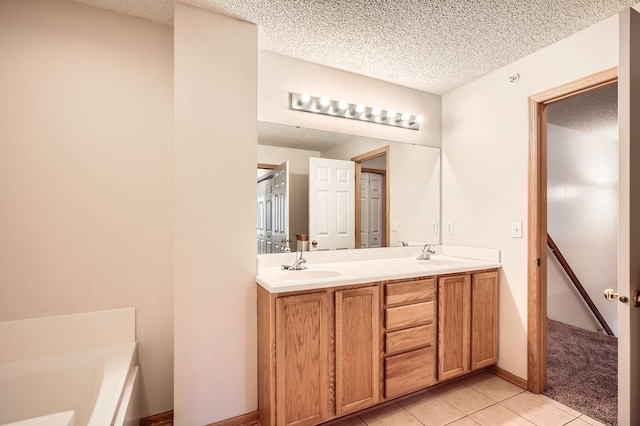 13626 Brass Pkwy Unit 27, Rosemount, MN 55068 - full bath with a textured ceiling, double vanity, a sink, and tile patterned flooring