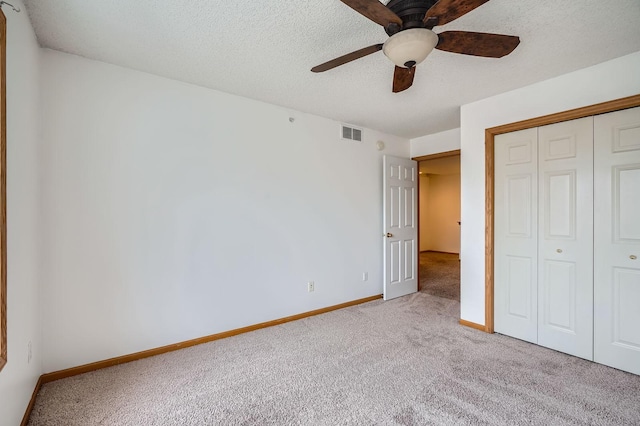 13626 Brass Pkwy Unit 27, Rosemount, MN 55068 - unfurnished bedroom featuring visible vents, a closet, baseboards, and carpet floors