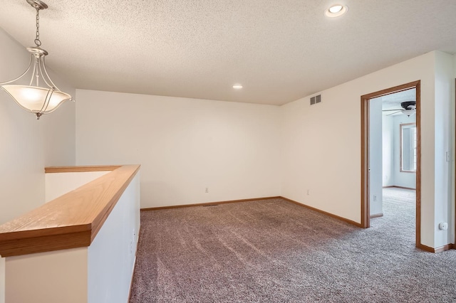 13626 Brass Pkwy Unit 27, Rosemount, MN 55068 - empty room featuring visible vents, baseboards, a textured ceiling, recessed lighting, and carpet flooring