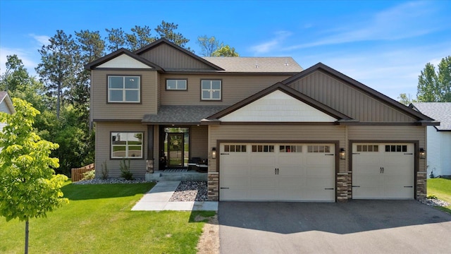 1030 Bellaire Blvd NW, Isanti, MN 55040 - craftsman house with asphalt driveway, a front lawn, roof with shingles, a garage, and stone siding