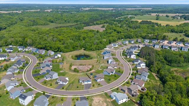 1030 Bellaire Blvd NW, Isanti, MN 55040 - aerial overview of property's location with a heavily wooded area and nearby suburban area