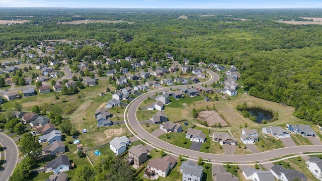 1030 Bellaire Blvd NW, Isanti, MN 55040 - aerial view of property and surrounding area with a forest and nearby suburban area