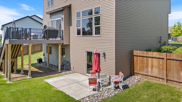 1030 Bellaire Blvd NW, Isanti, MN 55040 - rear view of property with a patio, central AC unit, and a wooden deck