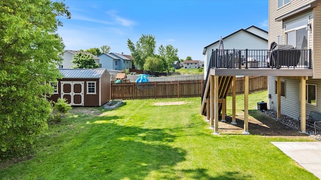 1030 Bellaire Blvd NW, Isanti, MN 55040 - view of yard featuring a residential view, a deck, and central AC unit