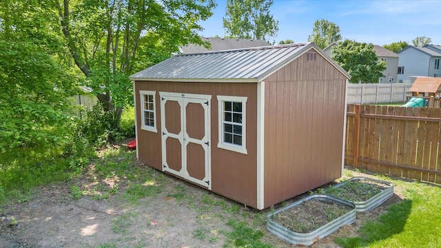 1030 Bellaire Blvd NW, Isanti, MN 55040 - view of shed featuring a vegetable garden