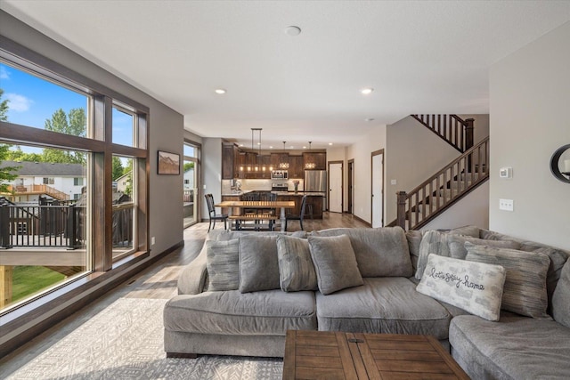 1030 Bellaire Blvd NW, Isanti, MN 55040 - living area with recessed lighting, stairs, and dark wood finished floors