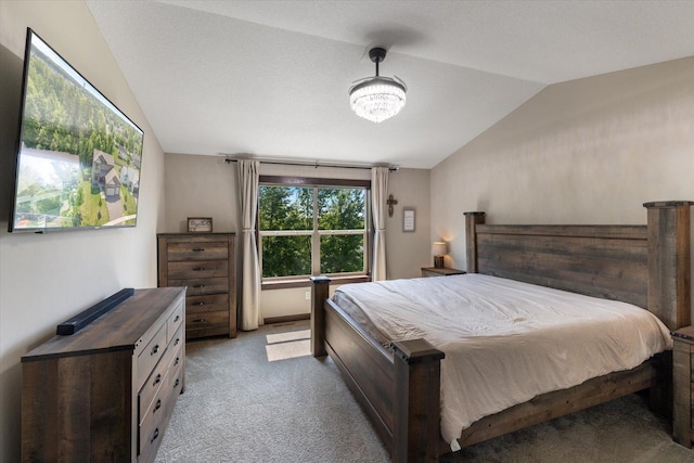 1030 Bellaire Blvd NW, Isanti, MN 55040 - bedroom featuring vaulted ceiling, carpet floors, and a chandelier