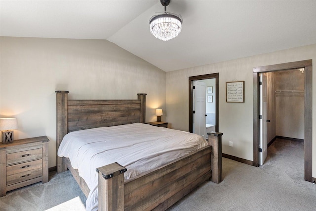 1030 Bellaire Blvd NW, Isanti, MN 55040 - bedroom featuring light carpet, lofted ceiling, baseboards, a walk in closet, and a chandelier