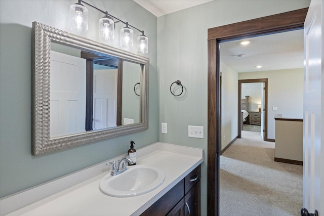 1030 Bellaire Blvd NW, Isanti, MN 55040 - bathroom with vanity and baseboards