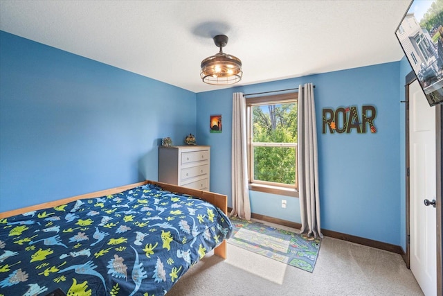 1030 Bellaire Blvd NW, Isanti, MN 55040 - carpeted bedroom with baseboards