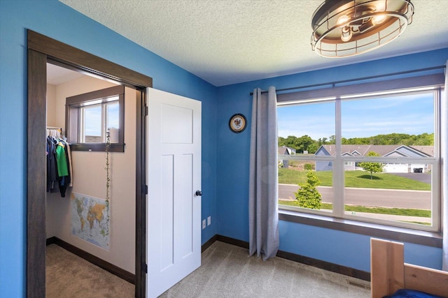 1030 Bellaire Blvd NW, Isanti, MN 55040 - interior space with baseboards and a textured ceiling