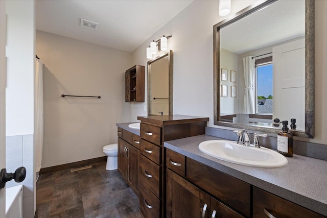 1030 Bellaire Blvd NW, Isanti, MN 55040 - bathroom with vanity, baseboards, and toilet