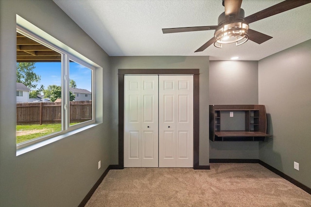 1030 Bellaire Blvd NW, Isanti, MN 55040 - unfurnished bedroom featuring light colored carpet, baseboards, a closet, and ceiling fan