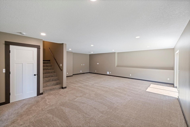 1030 Bellaire Blvd NW, Isanti, MN 55040 - finished basement with carpet, stairway, recessed lighting, a textured ceiling, and baseboards