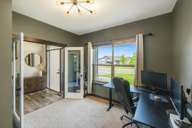 1030 Bellaire Blvd NW, Isanti, MN 55040 - office space featuring french doors, wood finished floors, a chandelier, and baseboards