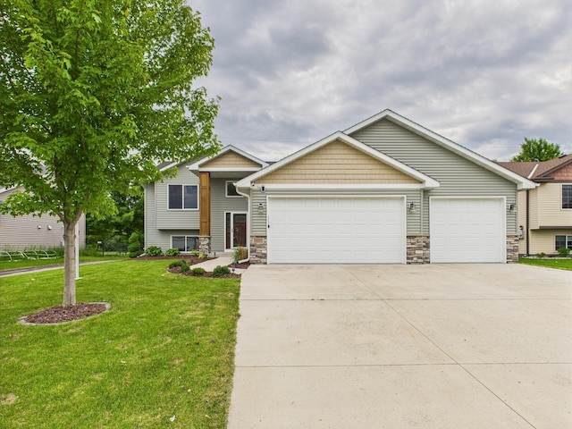 1214 Olivia St SE, New Prague, MN 56071 - tri-level home with stone siding, driveway, an attached garage, and a front yard