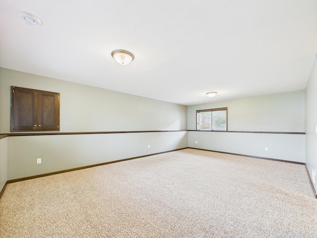 1214 Olivia St SE, New Prague, MN 56071 - spare room with light carpet and baseboards