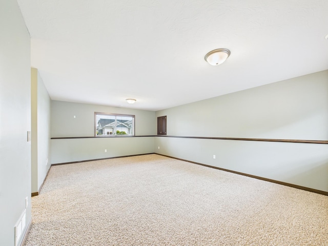 1214 Olivia St SE, New Prague, MN 56071 - unfurnished room featuring light carpet and baseboards
