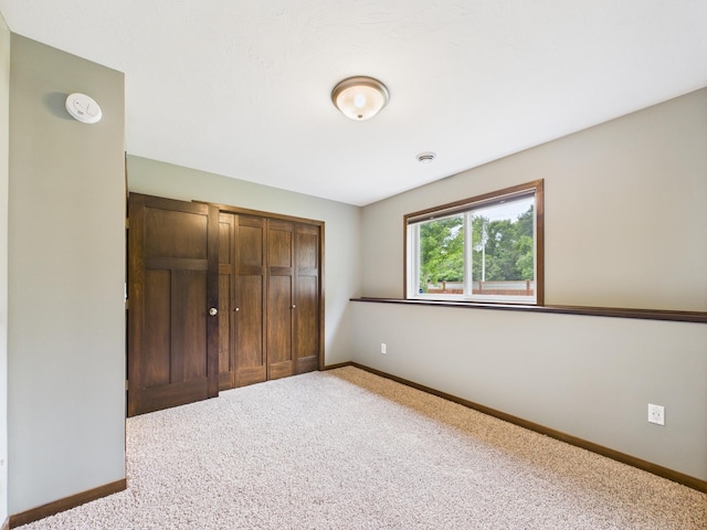 1214 Olivia St SE, New Prague, MN 56071 - unfurnished bedroom featuring carpet and baseboards