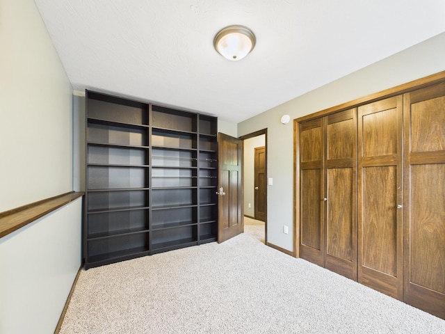 1214 Olivia St SE, New Prague, MN 56071 - unfurnished bedroom featuring carpet flooring, a closet, and baseboards