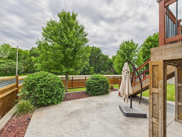 1214 Olivia St SE, New Prague, MN 56071 - fenced backyard featuring a patio area and view of wooded area