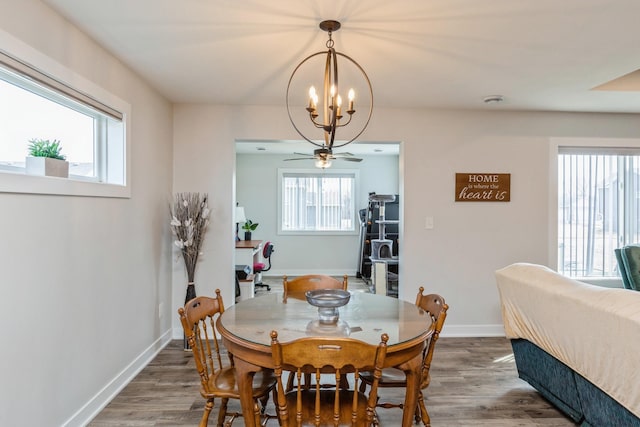 413 Fawn Run, Kenyon, MN 55946 - dining area with a chandelier, plenty of natural light, wood finished floors, and baseboards