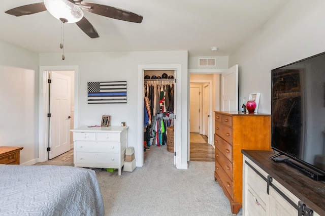 413 Fawn Run, Kenyon, MN 55946 - bedroom with light colored carpet, a closet, a spacious closet, baseboards, and ceiling fan