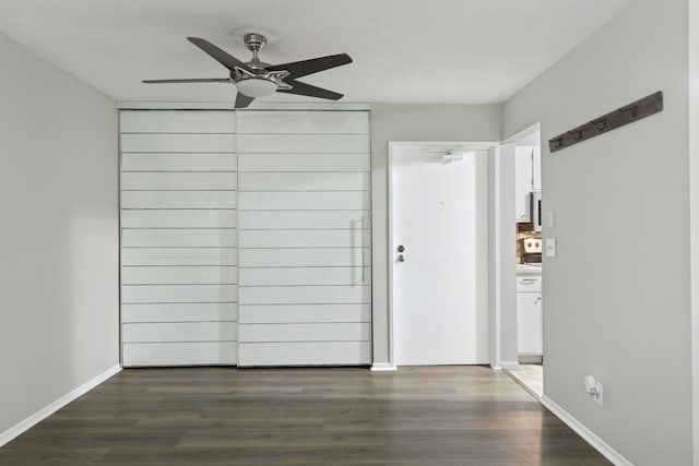 1903 Silver Bell Rd Unit 314, Eagan, MN 55122 - empty room featuring a ceiling fan and dark wood finished floors