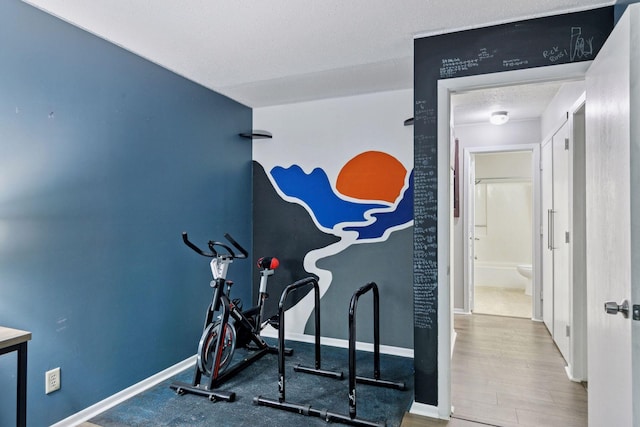 1903 Silver Bell Rd Unit 314, Eagan, MN 55122 - exercise area featuring a textured ceiling and baseboards