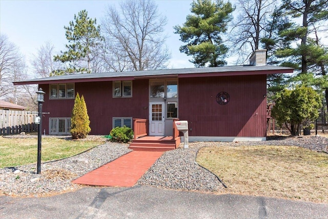 607 Cross Ave S, Amery, WI 54001 - raised ranch with a chimney and fence