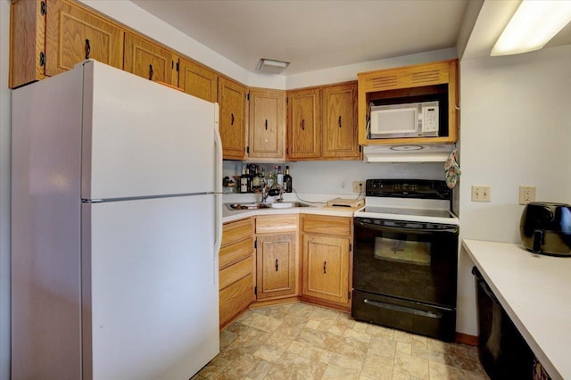607 Cross Ave S, Amery, WI 54001 - kitchen featuring a sink, light countertops, white appliances, and under cabinet range hood