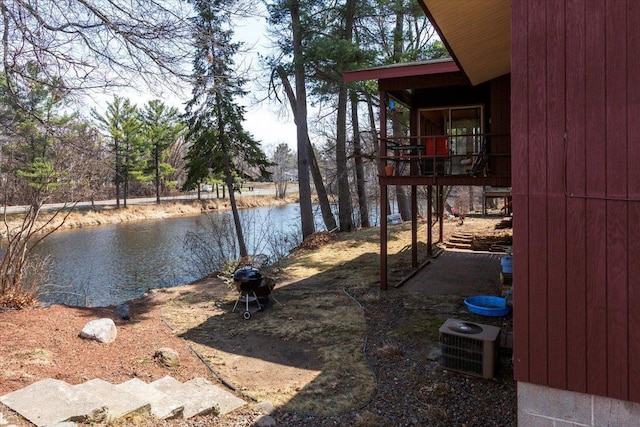 607 Cross Ave S, Amery, WI 54001 - view of yard featuring central AC and a water view