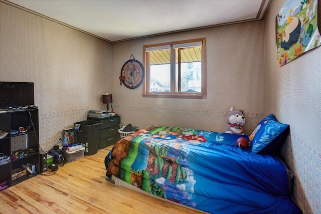 607 Cross Ave S, Amery, WI 54001 - bedroom with wood finished floors and wallpapered walls