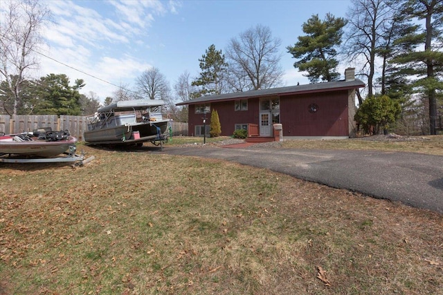 607 Cross Ave S, Amery, WI 54001 - exterior space featuring a yard, fence, and a chimney