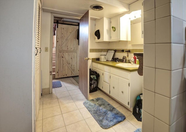 607 Cross Ave S, Amery, WI 54001 - bathroom featuring visible vents, tile patterned floors, and vanity