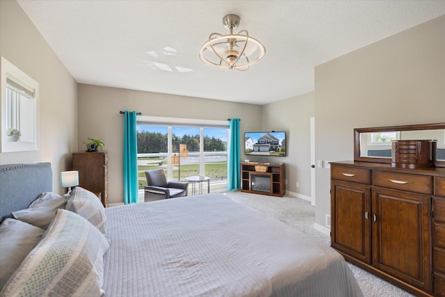 5360 Pine Island Rd, Woodbury, MN 55129 - bedroom featuring light carpet, a chandelier, and baseboards